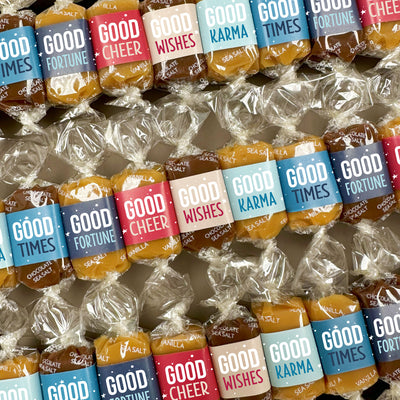 Gourmet caramels with colorful  holiday-themed wrappers in three flavors: sea salt, vanilla, and chocolate sea salt. Caramel wrappers feature positive quotes and messages of good cheer, good times, good fortune, good karma, and good wishes. 