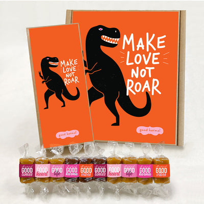 All-natural, gluten-free caramels shown funny gift boxes with a dinosaur and text that says "Make Love Not Roar." Each caramel is wrapped in positive quotes and Good Times; Good Heart; Good Life; Good Karma; and Good Vibes.