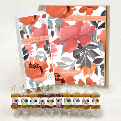 Good Karmal caramel gift boxes covered in illustrated pink and orange spring flowers and the words "Happy Easter." Caramels shown are wrapped in positive words, including: Good Times; Good Fortune; Good Quotes; Good Karma; and Good Vibes. Sea salt, Chocolate Sea Salt and Vanilla caramels.