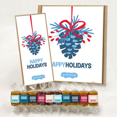 All-natural, kosher caramel holiday gift box from Good Karmal with a pinecone ornament illustration and the words Happy Holidays.