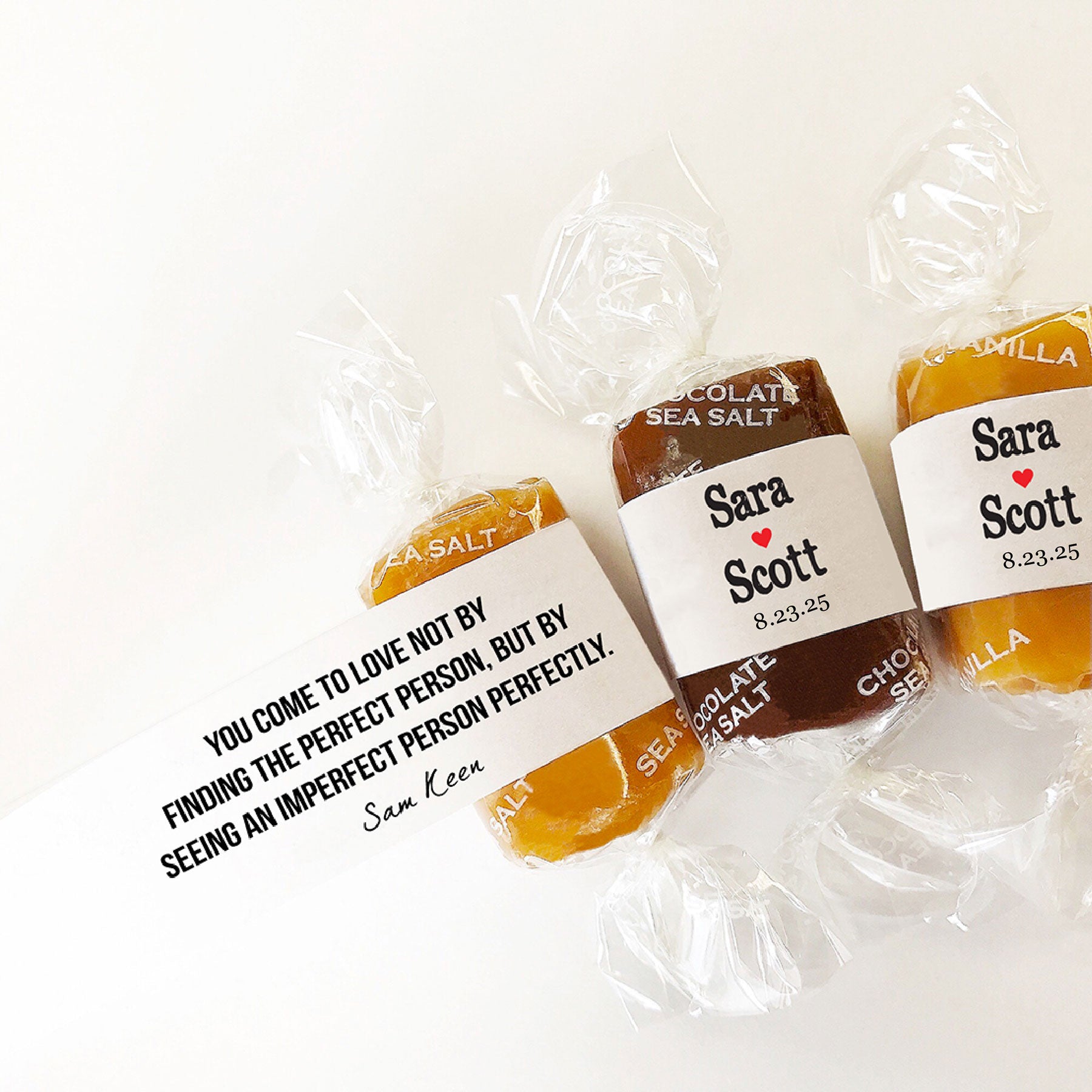 Three wrapped Good Karmal custom wedding favor caramels with personalized messages.