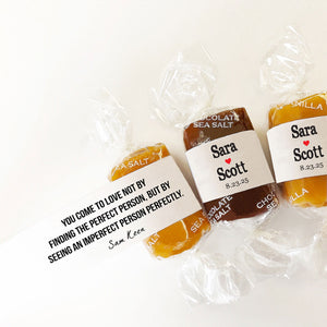 Three wrapped Good Karmal custom wedding favor caramels with personalized messages.