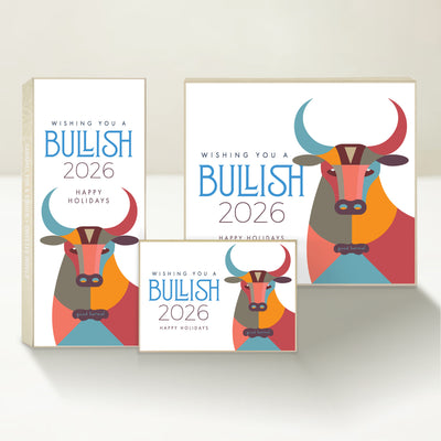 Three holiday-themed Good Karmal caramel gift boxes featuring a colorful illustrated bull, wishing happy holidays and a bullish new year. 