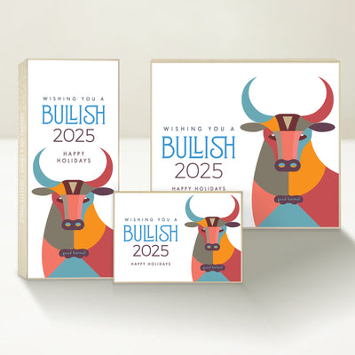 Three holiday-themed Good Karmal caramel gift boxes featuring a colorful illustrated bull, wishing happy holidays and a bullish new year. 