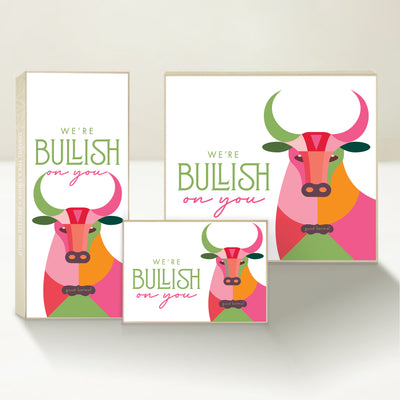 Three Good Karmal caramel gift boxes featuring a colorful illustrated bull and the words "We're bullish on you."