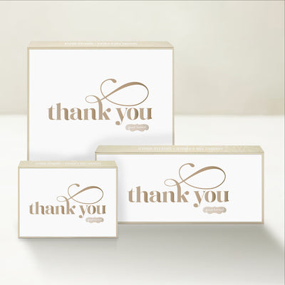 Three Good Karmal caramel gift boxes that say "thank you" in an elegant script on a white background.