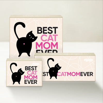 Three Good Karmal caramel gift boxes that say "Best Cat Mom Ever" with a whimsical illustration of a cat.