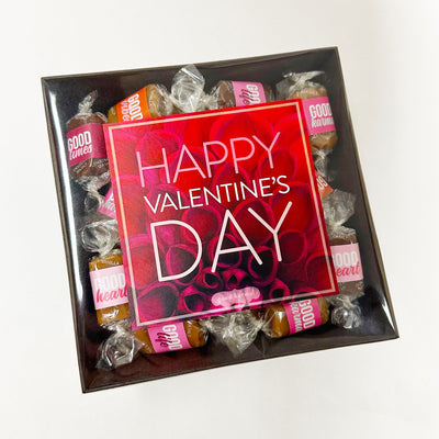 Gift basket with gourmet caramels with colorful  Valentine-inspired wrappers in three flavors: sea salt, vanilla, and chocolate sea salt. Caramel wrappers feature positive quotes and messages of good karma, good times, good heart, good vibes, and good life. 